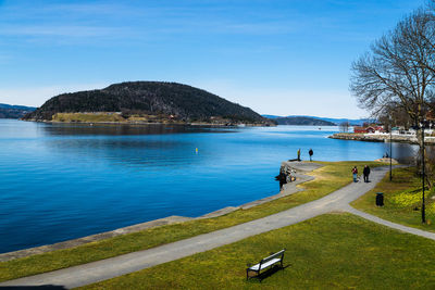 Scenic view of river and mountain against sky