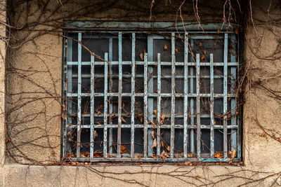 Abandoned building seen through window