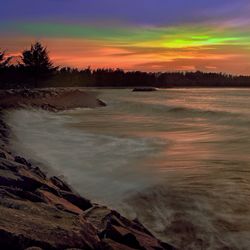 Scenic view of sea at sunset