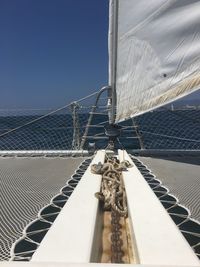 Boat sailing on sea against sky