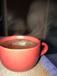 Close-up of tea light candle on table