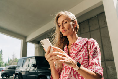 Young woman using mobile phone