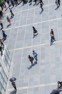 High angle view of people on footpath in city