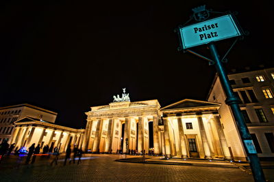 Low angle view of illuminated building at night