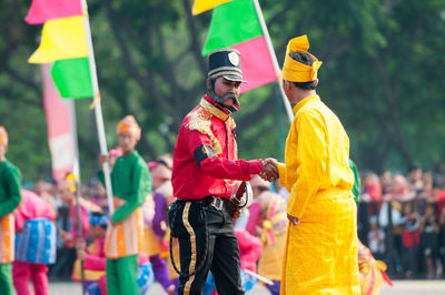 Rear view of people in traditional clothing