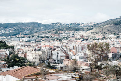 Aerial view of cityscape against sky