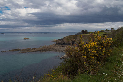 Scenic view of sea against cloudy sky