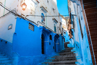 Low angle view of buildings against blue sky