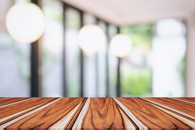 Close-up of wooden table at home