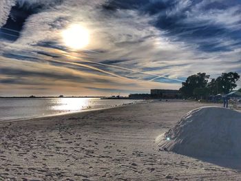 Scenic view of beach against sky during sunset