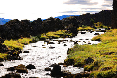 Scenic view of rocks against sky