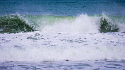 Waves splashing on shore