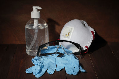 High angle view of glass bottle on table at home