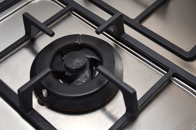 Close-up of gas stove burner in kitchen