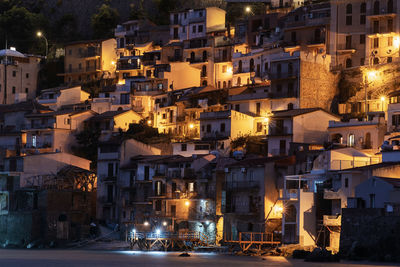 Illuminated buildings in town at night