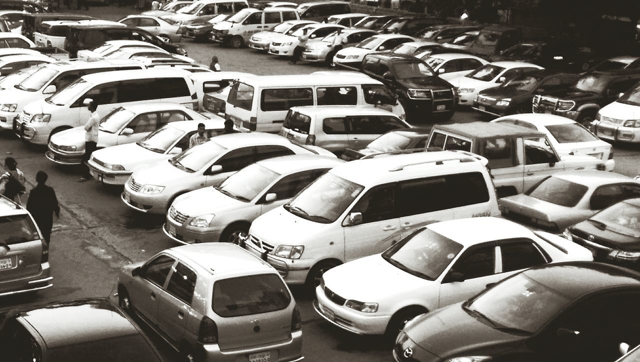 transportation, land vehicle, in a row, car, large group of objects, mode of transport, high angle view, abundance, full frame, repetition, indoors, arts culture and entertainment, backgrounds, order, street, no people, metal, day, arrangement, technology