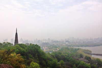 View of buildings in foggy weather