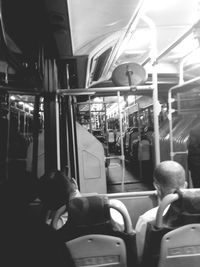 Rear view of man sitting in train