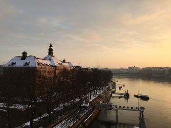 High angle view of river by city during winter