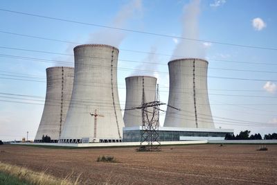 Cooling towers at nuclear power plant, energy self-sufficiency, greenhouse emission 