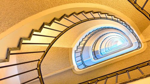 Low angle view of spiral staircase in building