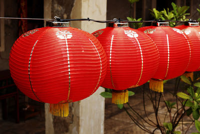 Close-up of red lanterns hanging in row