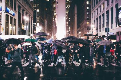 Crowd on wet street during rainy season at night