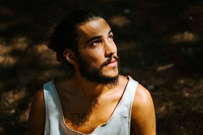 Portrait of young man looking away