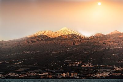 Scenic view of mountains against sky during sunset