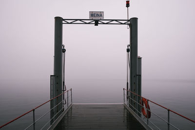 Pier over sea against sky