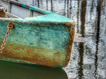 Close-up of rusty boat in water