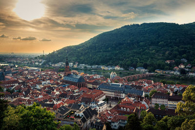 High angle shot of townscape against sky at sunset