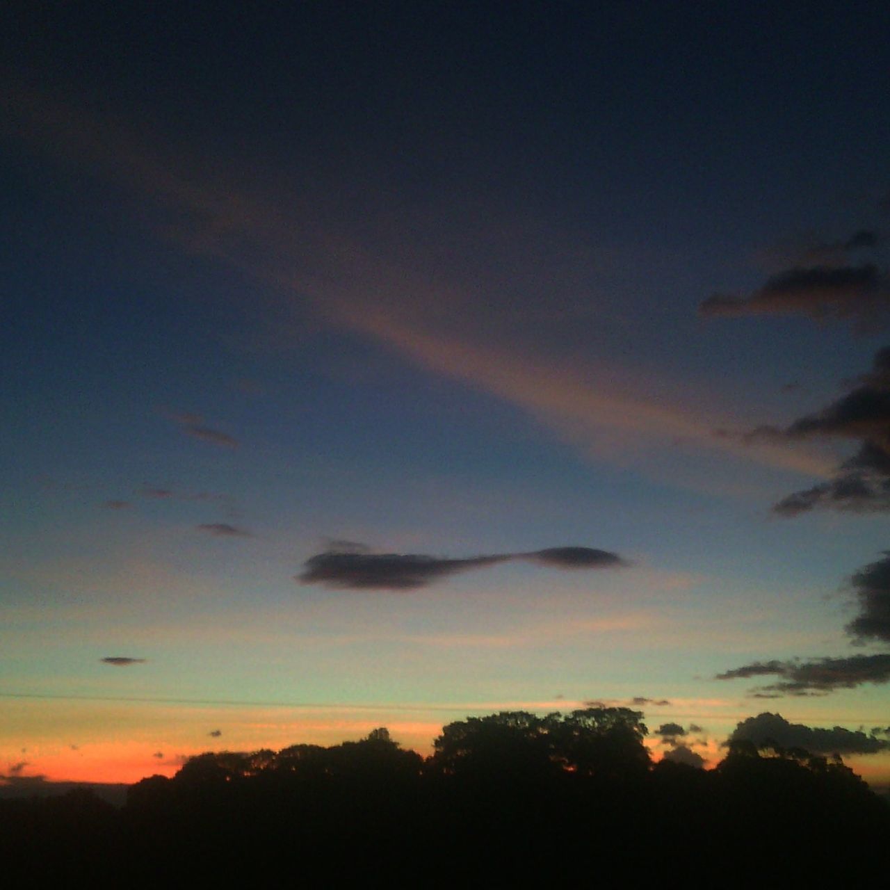 sunset, silhouette, scenics, beauty in nature, sky, tranquil scene, tranquility, tree, nature, idyllic, orange color, cloud - sky, dusk, dramatic sky, majestic, cloud, outdoors, low angle view, no people, landscape