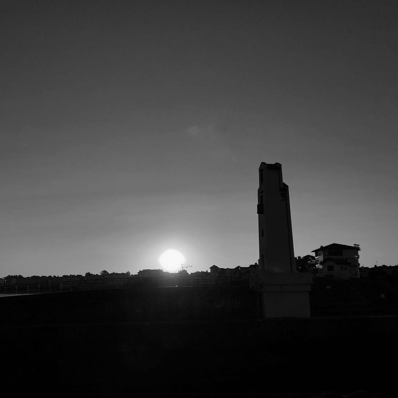 sky, building exterior, built structure, architecture, nature, copy space, no people, industry, factory, sun, outdoors, building, sunlight, smoke stack, environment, cloud - sky, silhouette, city, lens flare, day, pollution, bright