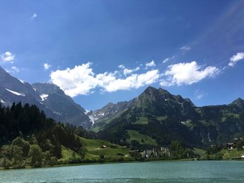 Scenic view of lake against cloudy sky