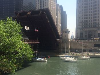 Boats in canal along buildings