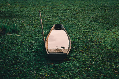 High angle view of abandoned car on field