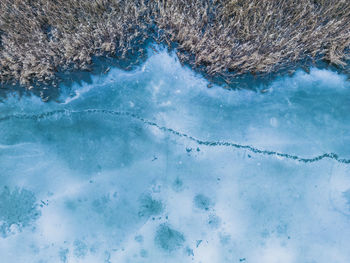 Aerial view of a frozen lake. ice sheet background. frozen waves on the lake. ice background. 