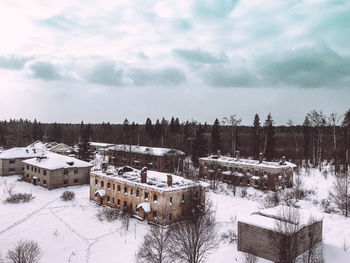 Scenic view of snow covered field against sky