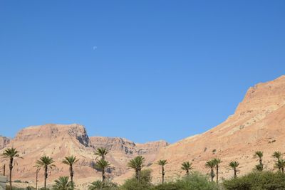 Scenic view of mountains against clear blue sky