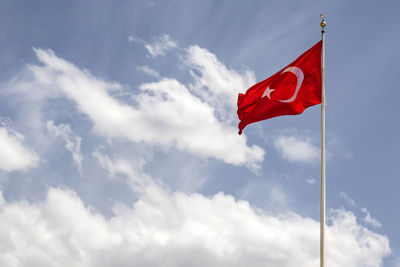 Low angle view of flag against sky