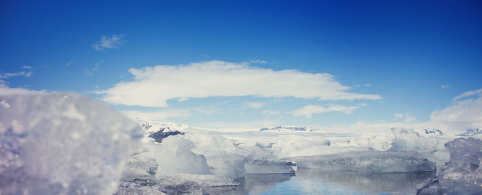 Scenic view of sea against blue sky