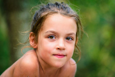 Close-up portrait of shirtless girl