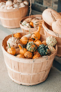 Pumpkins in baskets. autumn fall. store outdoors decoration. thanksgiving and halloween holiday 