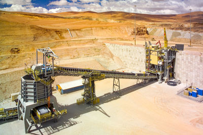 Rock crusher and conveyor belt at the plant of a copper mine in chile.