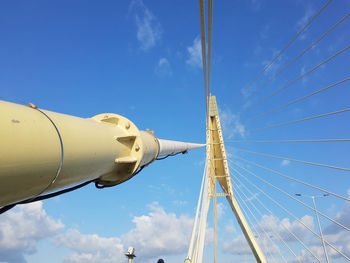 Low angle view of communications tower against sky