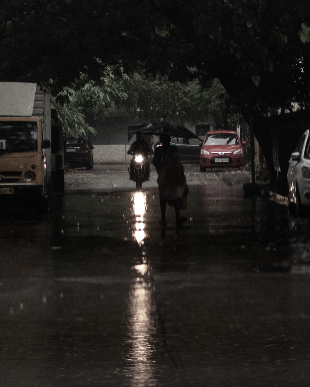 CARS ON ROAD DURING RAINY SEASON