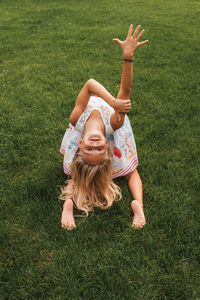 Full length of woman lying on field