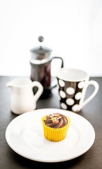 Close-up of coffee served on table