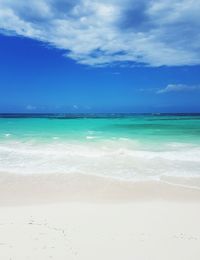 View of beach against cloudy sky